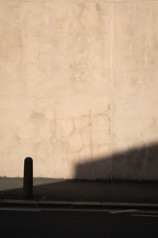 Bollard, blank wall, Bognor Regis. 2024.
